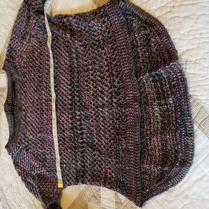 Like new multi colored crochet sweather. Faux zipper in back. High low.